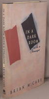 IN A DARK ROOM WITH A STRANGER