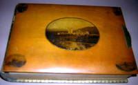 PHOTOGRAPH ALBUM, 19th Century high varnished honey-colored wood picturing six engraved Scottish scenes with brass clasp, leather spine and 26 boards all edges gilt with leather joints, 104 embellished photograph slots