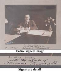 Theodore Roosevelt Signs A Photograph While President