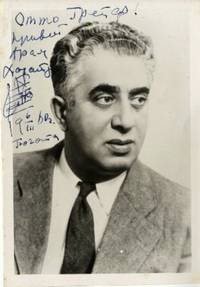 Bust-length photograph signed, inscribed and incorporating an autograph musical quotation