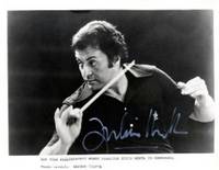 Reproduction photograph in animated half-length conducting pose, signed in white ink