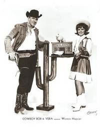 PROFESSIONAL PHOTOGRAPH  OF MANNY DINNERSTEIN IN CHARACTER AS COWBOY BOB & VERA, WESTERN MAGICIAN: