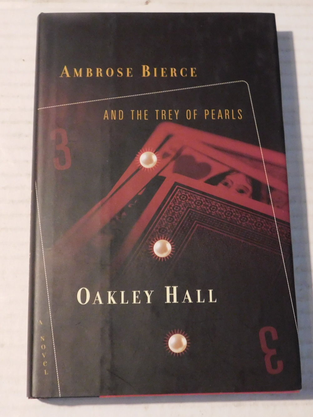 AMBROSE BIERCE AND THE TREY OF PEARLS.