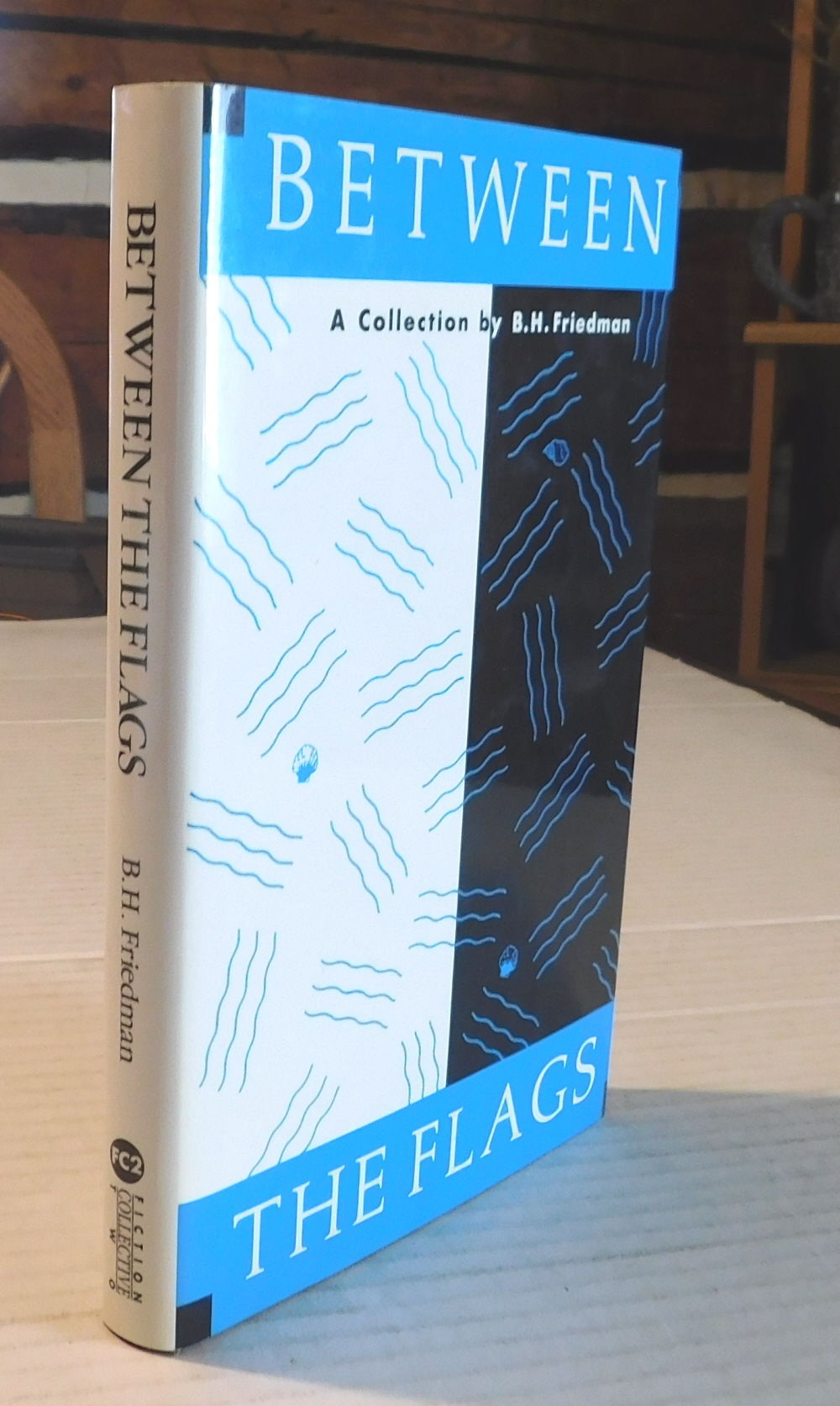 BETWEEN THE FLAGS: Uncollected Stories 1948-1990 by B.H. Friedman. [INSCRIBED & SIGNED by the author].