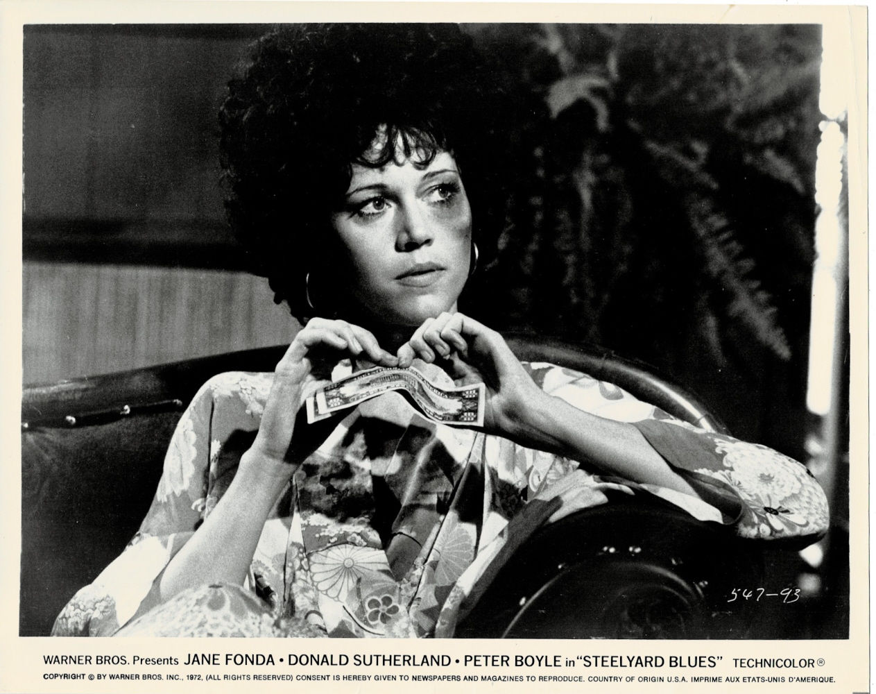 AN ORIGINAL BLACK & WHITE MOVIE STILL depicting JANE FONDA in a scene from STEELYARD BLUES.