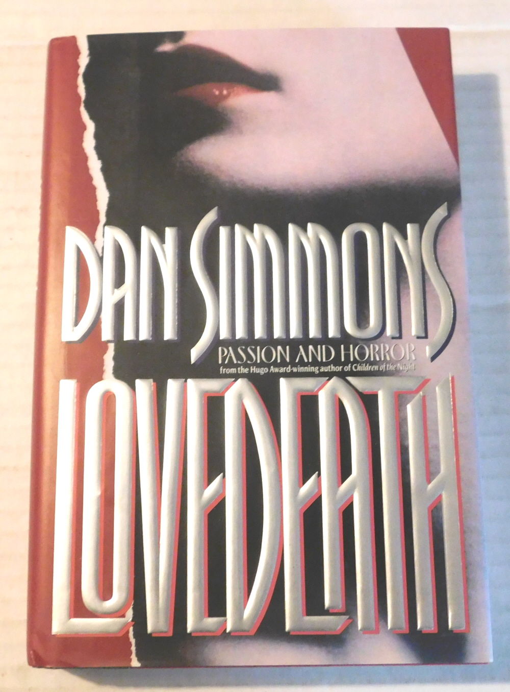 LOVEDEATH. [SIGNED by DAN SIMMONS].